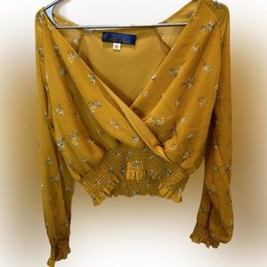 Francesca’s yellow floral cropped blouse